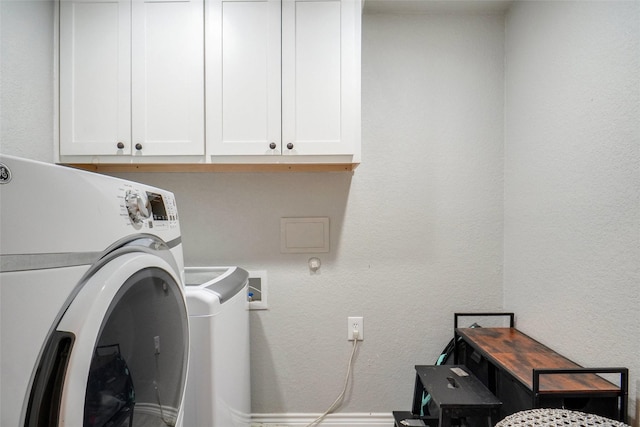 laundry area with washer / clothes dryer and cabinet space