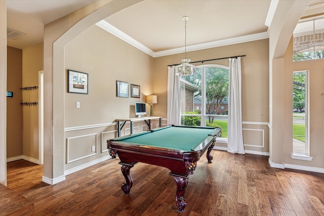 playroom featuring billiards, visible vents, arched walkways, wood finished floors, and ornamental molding
