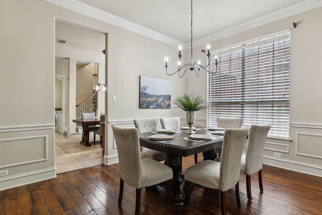 1016 Arches Park Dr, Allen, TX 75013 - dining space with a chandelier, crown molding, hardwood / wood-style flooring, wainscoting, and stairs