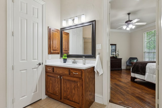1016 Arches Park Dr, Allen, TX 75013 - bathroom with crown molding, a ceiling fan, ensuite bathroom, vanity, and tile patterned flooring