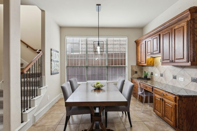 1016 Arches Park Dr, Allen, TX 75013 - dining area featuring stairs, light tile patterned flooring, and baseboards