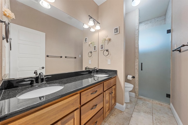 1009 Western Dr, Woodway, TX 76712 - full bath with a sink, a shower stall, toilet, and double vanity