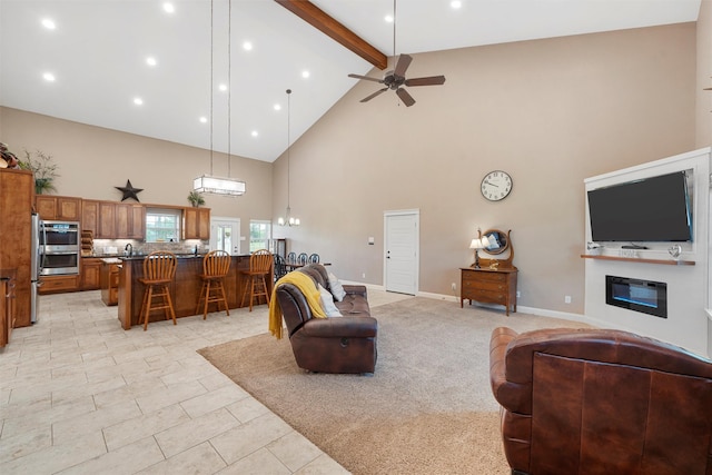 1009 Western Dr, Woodway, TX 76712 - living area featuring beam ceiling, high vaulted ceiling, a glass covered fireplace, a ceiling fan, and baseboards