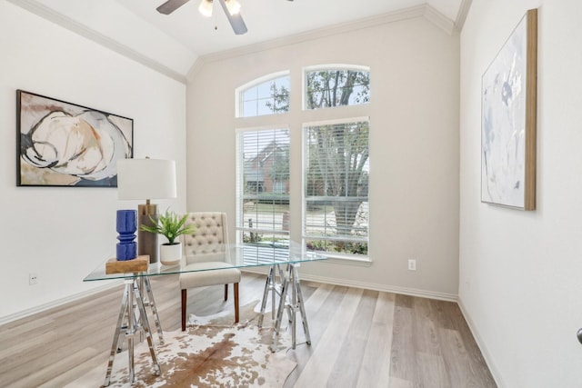 office space featuring crown molding, a ceiling fan, lofted ceiling, and wood finished floors