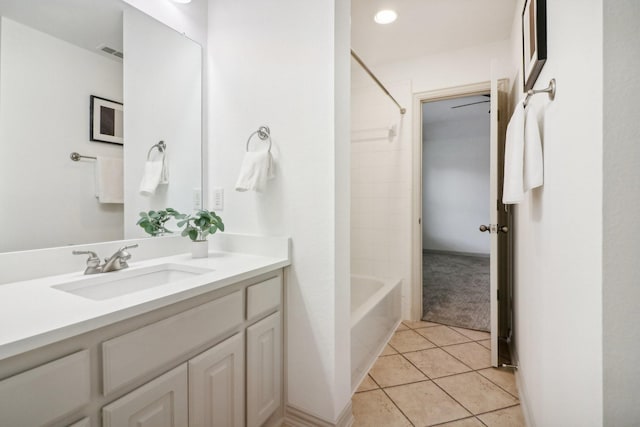 full bathroom with tile patterned floors, washtub / shower combination, vanity, and visible vents
