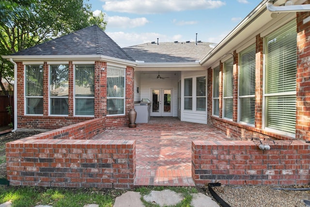 view of patio / terrace featuring a ceiling fan and french doors