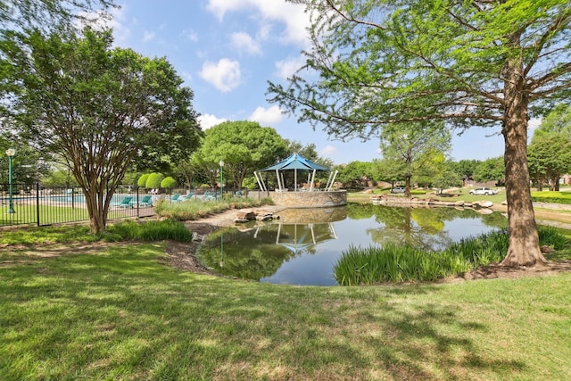 view of water feature featuring a gazebo and fence