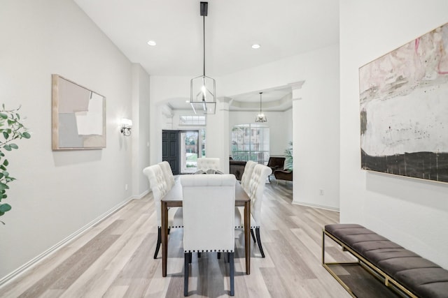 dining room with recessed lighting, baseboards, and light wood-style flooring