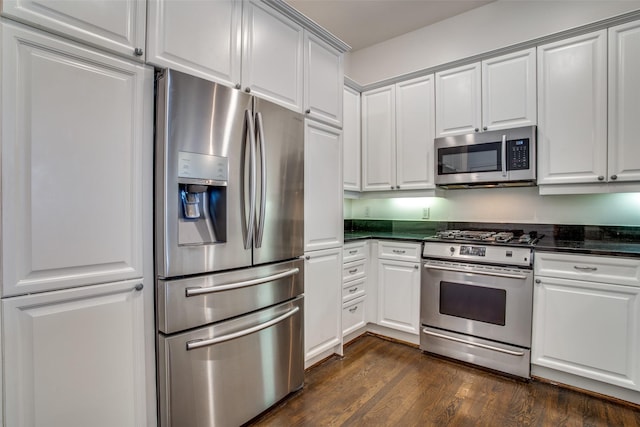 kitchen with white cabinetry, appliances with stainless steel finishes, and dark wood-style floors
