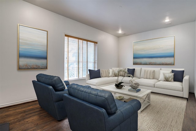 living area with recessed lighting, baseboards, and dark wood-style flooring