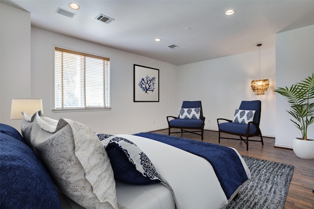 bedroom featuring recessed lighting, wood finished floors, and visible vents