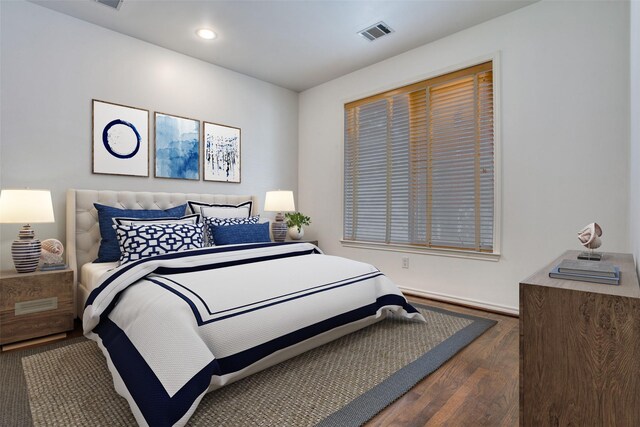 bedroom featuring visible vents, recessed lighting, baseboards, and wood finished floors