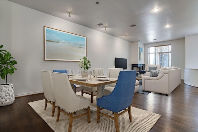 dining room with visible vents, recessed lighting, baseboards, and wood finished floors