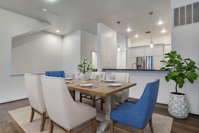 dining space featuring recessed lighting, dark wood finished floors, and visible vents
