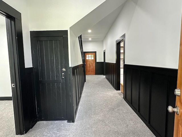 hall with carpet, wainscoting, and recessed lighting