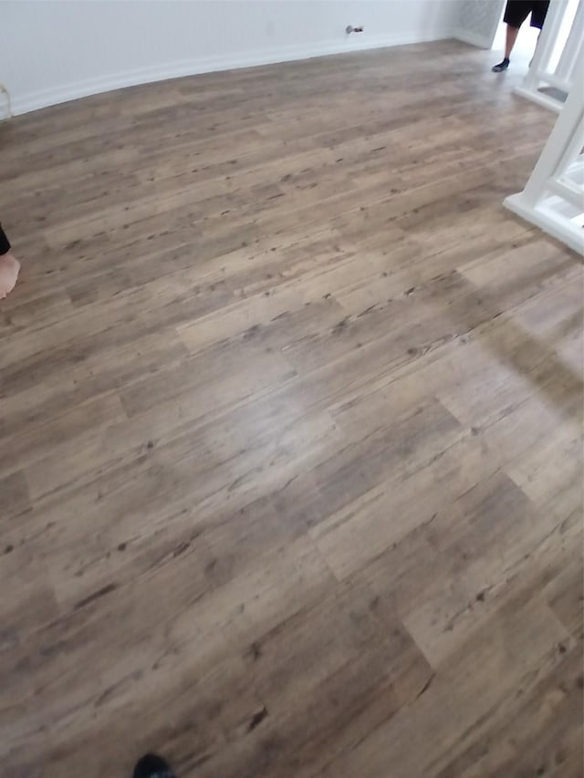 details with baseboards and wood finished floors
