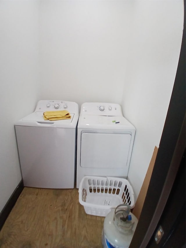 laundry area with washing machine and clothes dryer