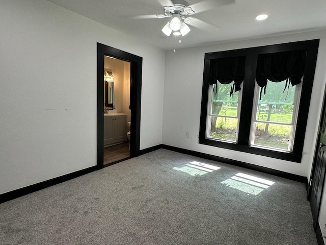 carpeted empty room featuring baseboards, a ceiling fan, and recessed lighting
