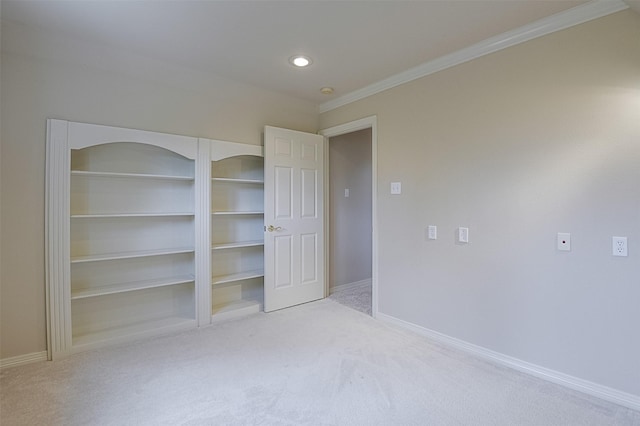 unfurnished bedroom with baseboards, ornamental molding, carpet, and recessed lighting