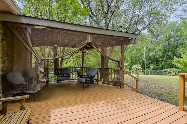 wooden terrace with a yard