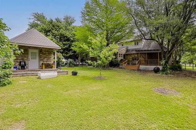 view of yard with a wooden deck