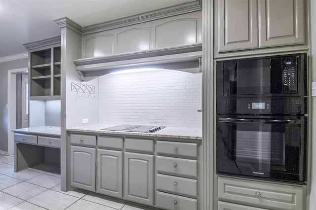 kitchen featuring ornamental molding, decorative backsplash, light tile patterned floors, black appliances, and gray cabinetry