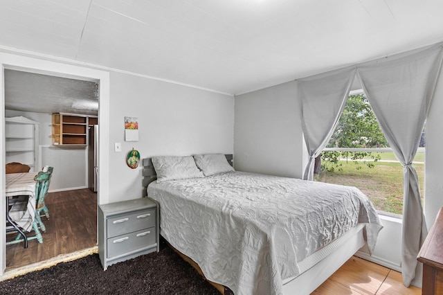 bedroom with wood finished floors