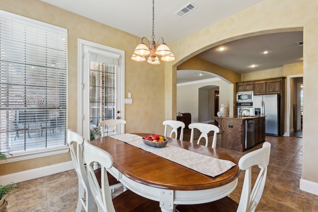 5403 Englenook Dr, Parker, TX 75002 - dining space with visible vents, arched walkways, baseboards, a notable chandelier, and recessed lighting