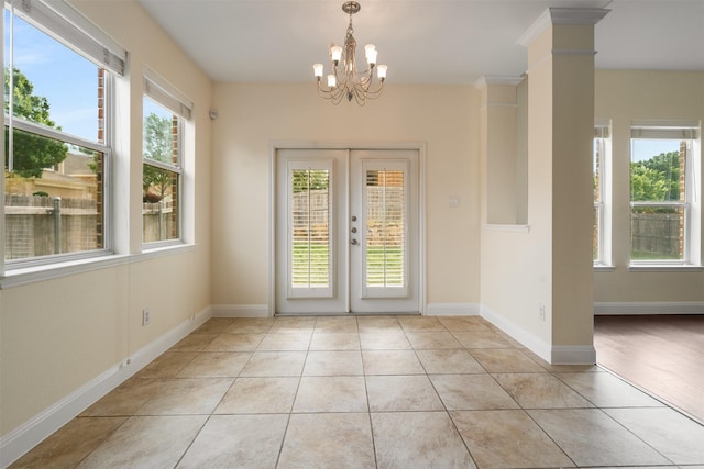 2719 Foxpoint Trl, Arlington, TX 76017 - doorway to outside featuring a chandelier, light tile patterned floors, french doors, and baseboards