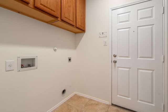 laundry area featuring baseboards, hookup for a washing machine, gas dryer hookup, electric dryer hookup, and cabinet space
