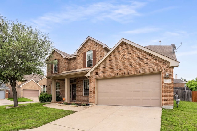 traditional-style house featuring concrete driveway, a front lawn, and brick siding