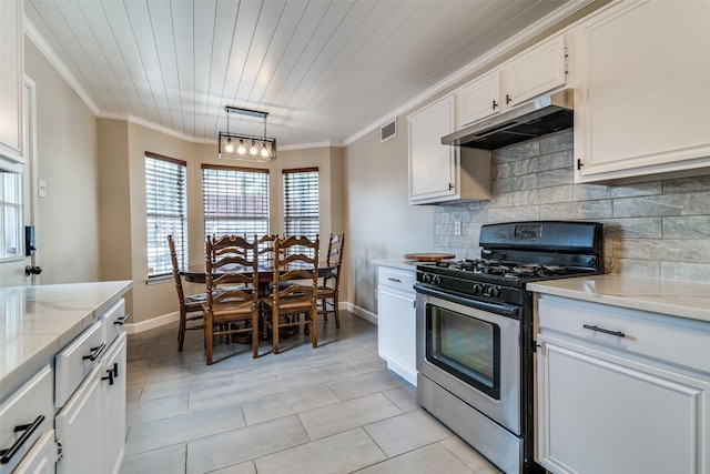kitchen featuring visible vents, decorative backsplash, baseboards, stainless steel gas range, and under cabinet range hood