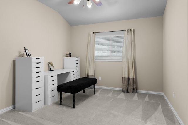 sitting room featuring ceiling fan, vaulted ceiling, light carpet, and baseboards