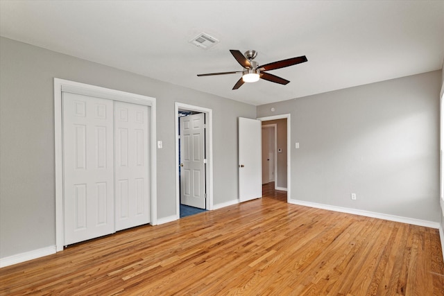 unfurnished bedroom featuring visible vents, baseboards, and light wood-type flooring