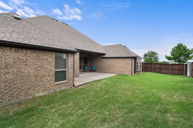 view of yard with a fenced backyard and a patio area