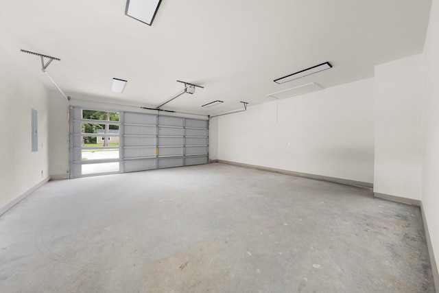 928 College St, Sulphur Springs, TX 75482 - garage with baseboards and a garage door opener