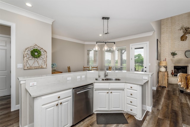 kitchen featuring white cabinets, a sink, a fireplace, dishwasher, and dark wood finished floors