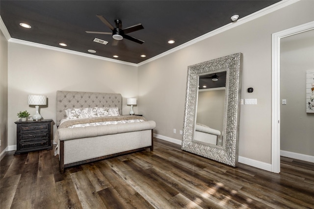 bedroom with visible vents, baseboards, crown molding, and wood finished floors
