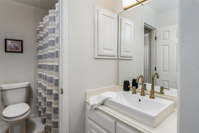 bathroom with vanity, toilet, and a shower with shower curtain