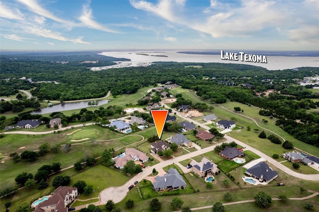 bird's eye view with a water view and a residential view