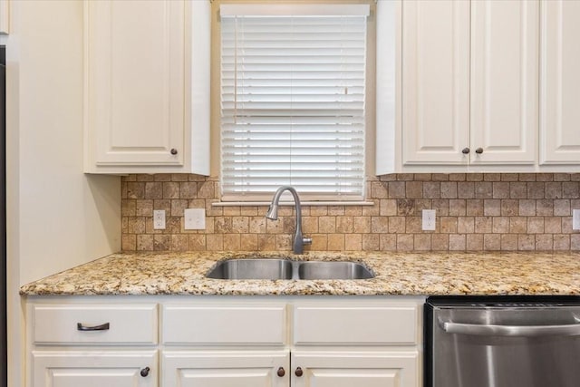 309 Nash Dr, Hewitt, TX 76643 - kitchen with stainless steel dishwasher, light stone countertops, white cabinetry, tasteful backsplash, and a sink