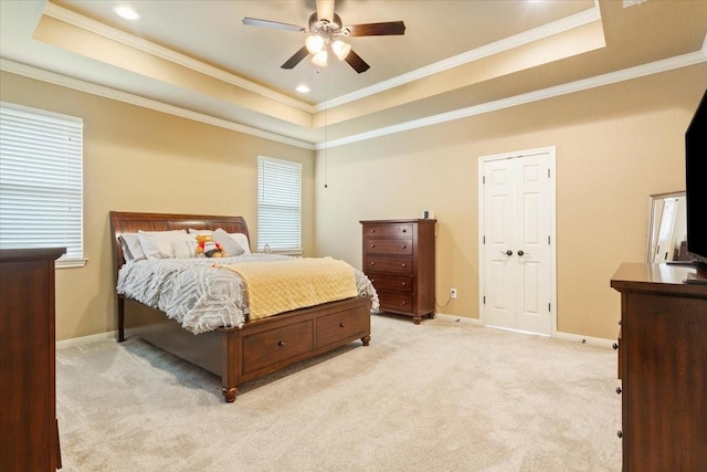309 Nash Dr, Hewitt, TX 76643 - bedroom featuring a tray ceiling, ornamental molding, baseboards, and light carpet