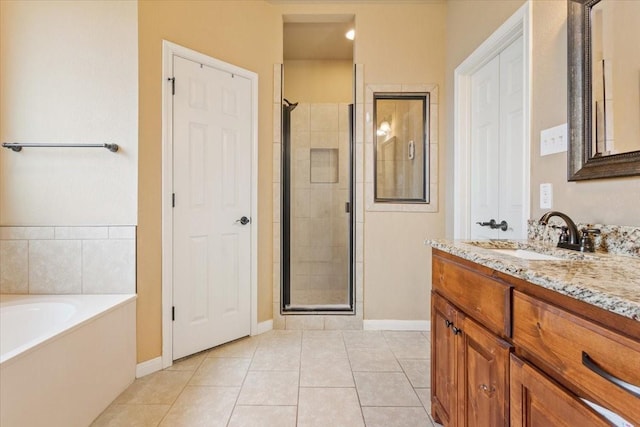 309 Nash Dr, Hewitt, TX 76643 - bathroom with baseboards, a shower stall, tile patterned flooring, and vanity