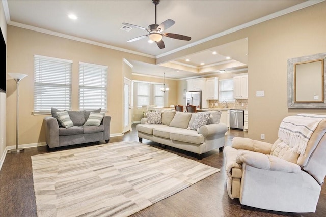309 Nash Dr, Hewitt, TX 76643 - living area with crown molding, baseboards, ceiling fan, and dark wood-style floors