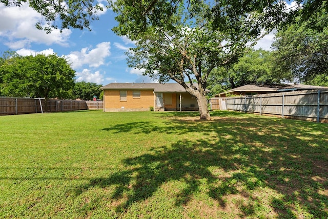 view of yard with a fenced backyard