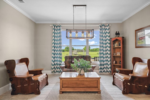 sitting room featuring crown molding, baseboards, and wood finished floors