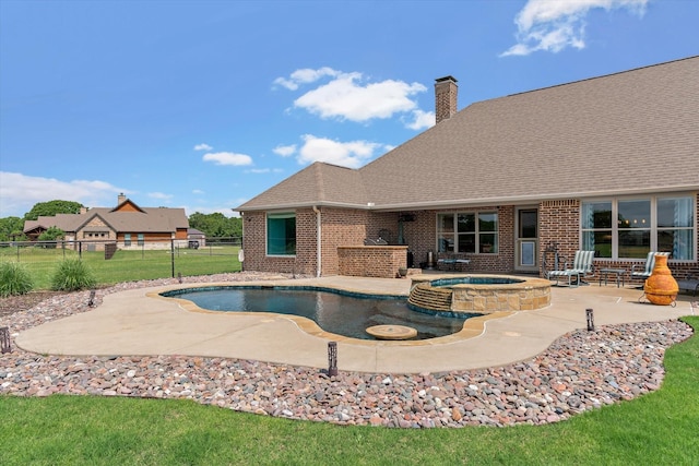 view of swimming pool featuring fence, a lawn, a patio area, and a pool with connected hot tub