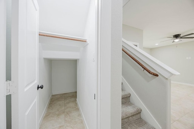 3600 Howard St, Fort Worth, TX 76119 - stairway featuring a ceiling fan, baseboards, and tile patterned floors