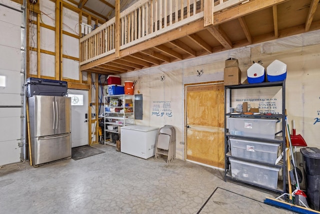 garage featuring freestanding refrigerator and refrigerator