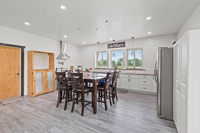 dining space featuring recessed lighting and light wood-type flooring